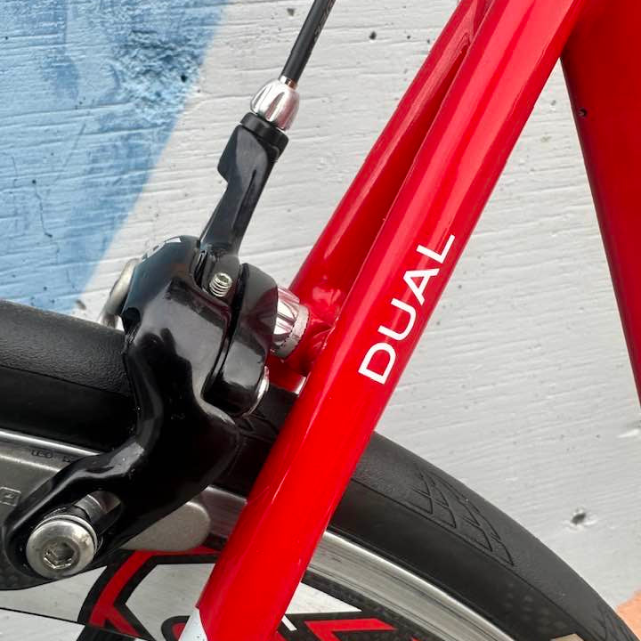 Cervelo Dual rear seat stay with "DUAL" branding in white on red bicycle