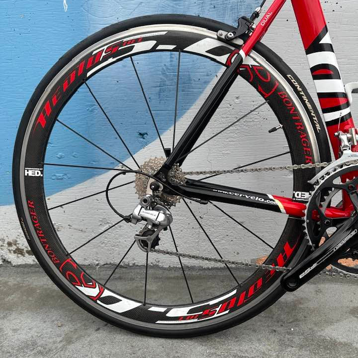 Cervelo Dual rear wheel with red and black rim design 