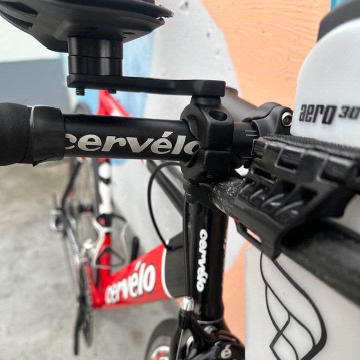 Close-up of a Cervélo  Dual bicycle with handlebar and front wheel.